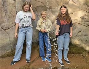 students post by waterfall in Germany